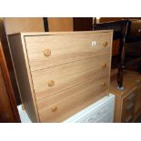 A light oak effect bedroom chest of drawers, height 65.5cm, width 76cm approx.