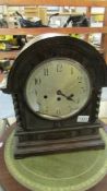 An Edwardian oak bracket clock with Junghens movement, no key or pendulum, fingers loose, glass a/f,