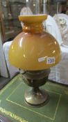 A brass Aladdin oil lamp.