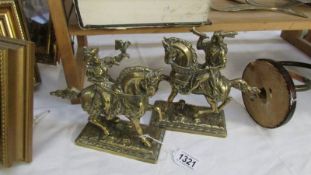 A pair of cast brass classical figures on horse back.