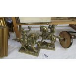 A pair of cast brass classical figures on horse back.