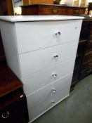 A white melamine bedroom dressing table, (missing end of 1 knob) height 122cm, width 78cm approx.