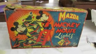 A boxed set of vintage Mazda Mickey Mouse lights.
