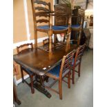 A dark oak refectory style dining table and 6 ladderback chairs, height 78cm,