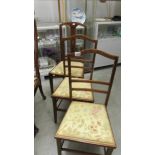 A pair of inlaid bedroom chairs and one other.