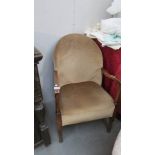 A 1930's oak framed arm chair.