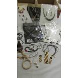 A mixed lot of costume jewellery including necklaces, bracelets, earrings etc.