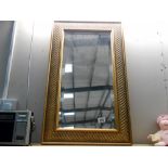A gilded bevel edge mirror 76cm x 45cm