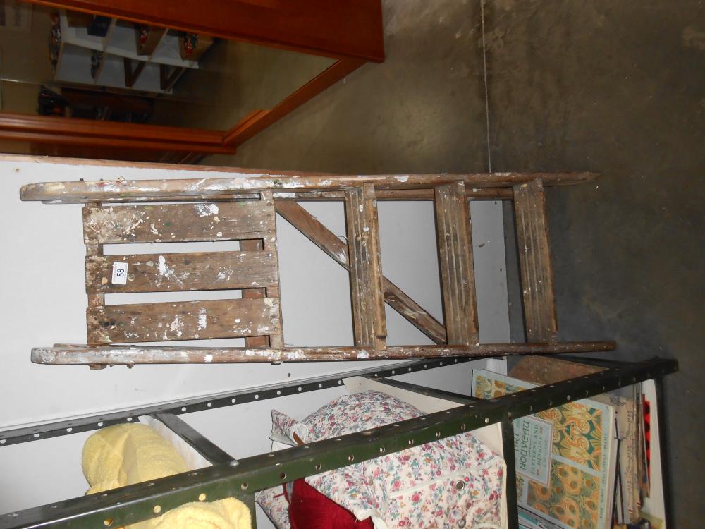 A small wooden step ladder,