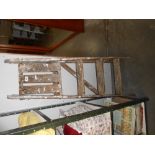 A small wooden step ladder,