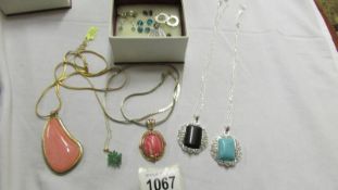 5 stone set pendants and 9 pairs of earrings.
