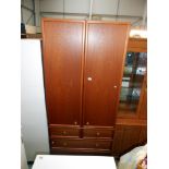 A G-Plan teak 2 door wardrobe on 3 drawers, height 203cm, width 90cm, approx.