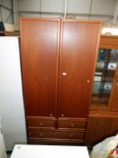 A G-Plan teak 2 door wardrobe on 3 drawers, height 203cm, width 90cm, approx.