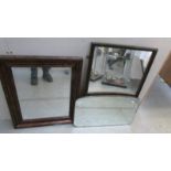 A framed bevel edged mirror and 2 other mirrors.