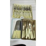 A boxed set of fish knives and forks and other cutlery.