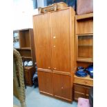 A teak effect gents wardrobe,