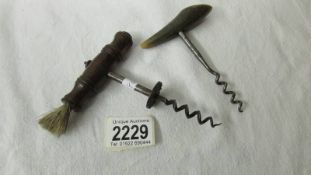 2 old corkscrews.