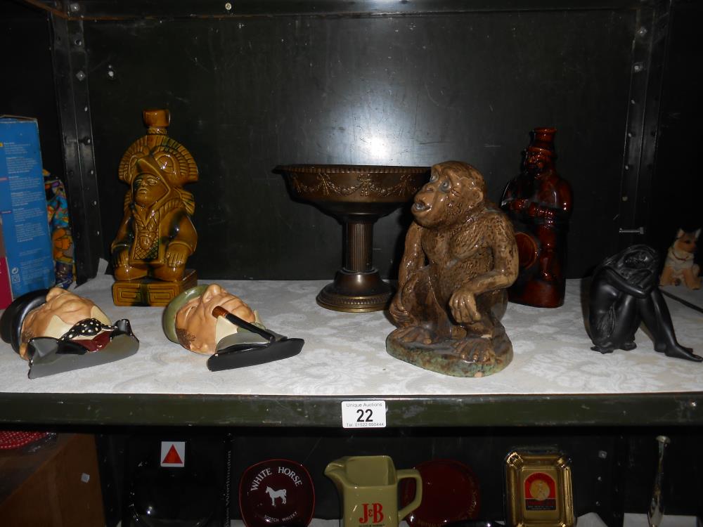A pottery monkey, 2 novelty decanters (1 missing stopper) brass comport,