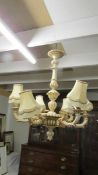 A large 6 arm wooden chandelier complete with ceiling rose, 71 cm diameter x 80 cm deep.