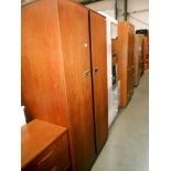 A Gents 2 door teak wardrobe with half hanging on one side and 4 shelves, tie rack,