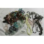 A mixed lot of assorted chip necklaces and bracelets,.