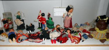 A large quantity of vintage costume dolls etc.