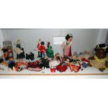 A large quantity of vintage costume dolls etc.