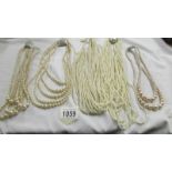 Five multi strand 'pearl' necklaces,