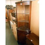 A mahogany finish corner cupboard (no key) height 182.5cm, width at widest 65cm, depth 40.