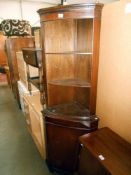 A mahogany finish corner cupboard (no key) height 182.5cm, width at widest 65cm, depth 40.