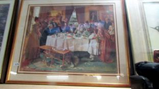 A framed and glazed print of a family at afternoon tea.