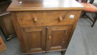 A Victorian pine 2 door 2 drawer cupboard.