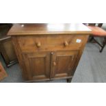 A Victorian pine 2 door 2 drawer cupboard.