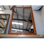 A large wooden framed mirror size 101cm x 72.
