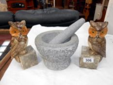 A pair of polished stone owl bookends (ears a/f) and a heavy stone pestle and mortar