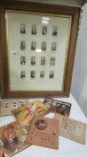 A framed and glazed set of collectors cards and a small quantity of tea cards.