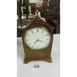 A 1970's mahogany mantle clock, maid spring is not winding the movement.