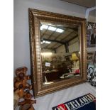 A gilt framed mirror, 65.5 x 55 cm, collect only.