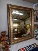 A gilt framed mirror, 65.5 x 55 cm, collect only.