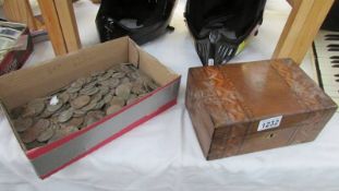 An inlaid box (no key and in dirty condition) and a box of very dirty coins.