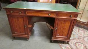 A Gillow of Lancaster knee hole desk. ****Condition report**** Width 128cm.