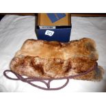 A Dubarry faux fur muff in original box