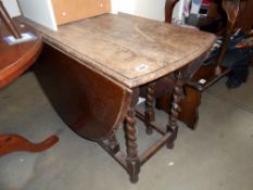 A Victorian oak gateleg table on barley twist legs, Height 72cm, open 156cm x 103cm,
