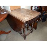 A Victorian oak gateleg table on barley twist legs, Height 72cm, open 156cm x 103cm,