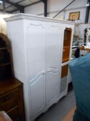 A white melamine 3 door wardrobe with mirrored door, height 199cm, width 136cm approx.