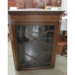 A mahogany astragal glazed corner cupboard.