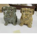 A pair of glazed potter bull dogs.