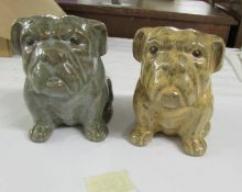 A pair of glazed potter bull dogs.
