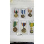 A sheet of 6 foreign medals including Saudi Arabia Liberation of Kuwait.