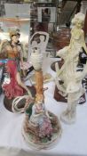 A figural table lamp and 4 assorted figures.